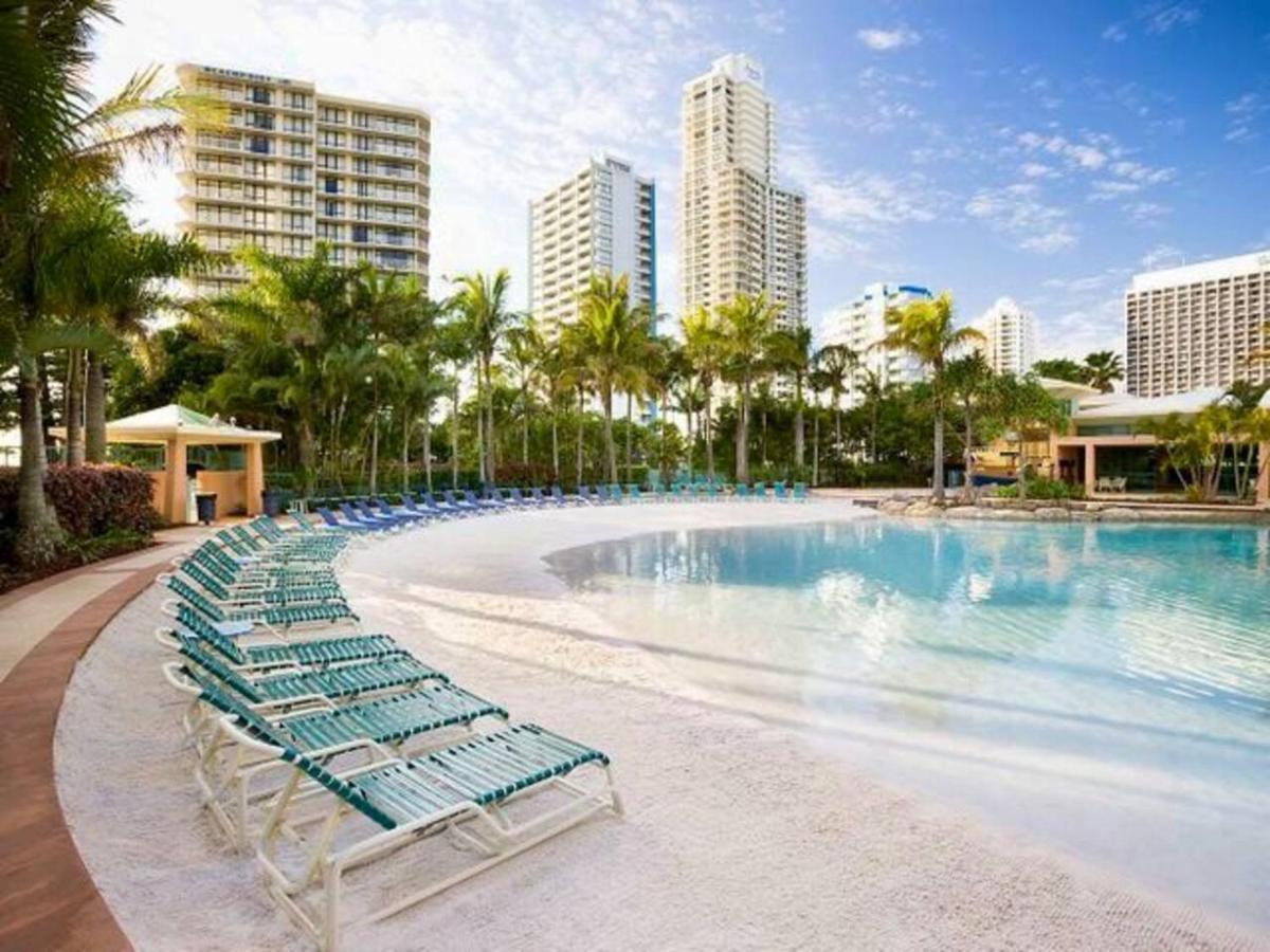 Energy And Poolside Serenity At Surfers Apartment